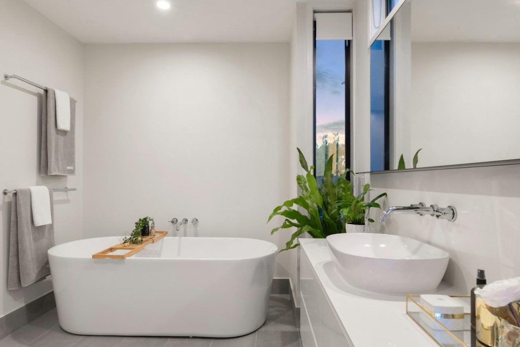 Bright bathroom with a freestanding tub and vessel sink