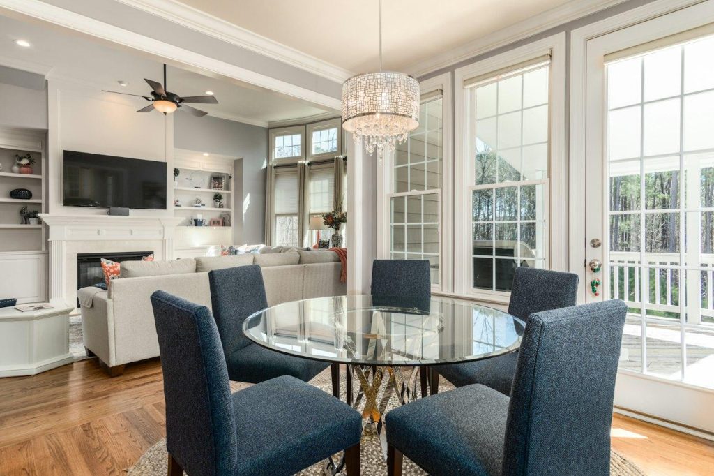 Dining room with wood-look flooring and large windows